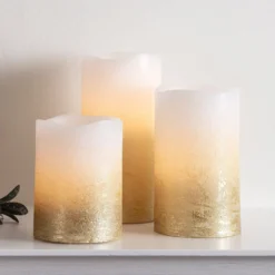3er Set LED Echtwachs Kerzen warmweiß flackernd gold