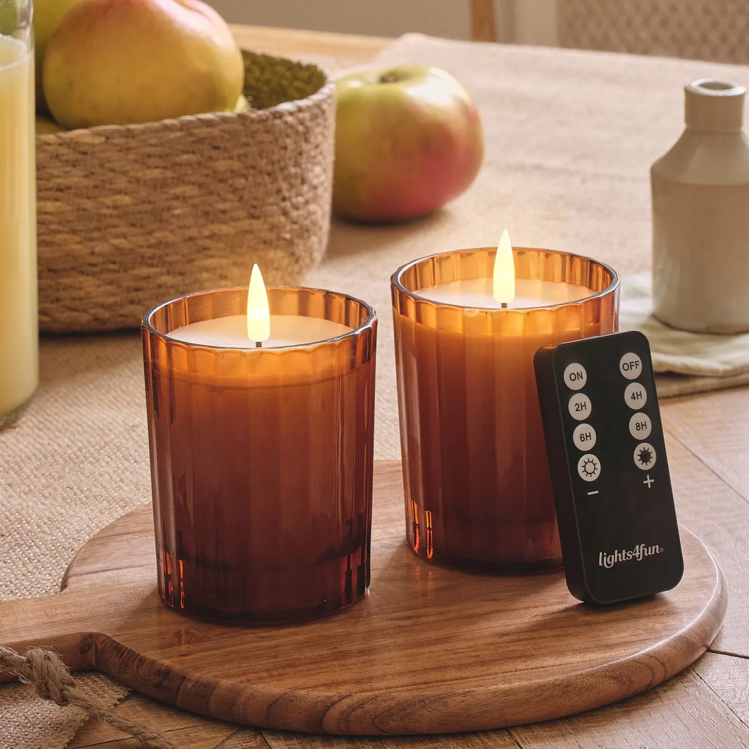 2er Set TruGlow® LED-Kerzen im geriffelten Glas in Orange mit Fernbedienung