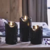 3er Set TruGlow® LED Stumpenkerzen Echtwachs schwarz mit Wachstropfen