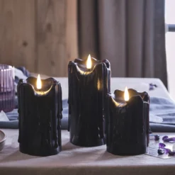 3er Set TruGlow® LED Stumpenkerzen Echtwachs schwarz mit Wachstropfen