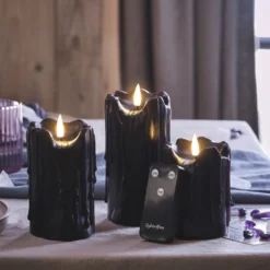 3er Set TruGlow® LED Stumpenkerzen Echtwachs schwarz mit Wachstropfen