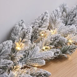 1,5m Weihnachtsgirlande mit Schnee beleuchtet