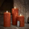 TruGlow® LED Kerzen Echtwachs Trio orange Ø 10cm mit Fernbedienung