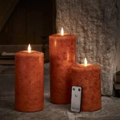 TruGlow® LED Kerzen Echtwachs Trio orange Ø 10cm mit Fernbedienung