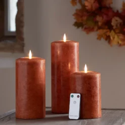 TruGlow® LED Kerzen Echtwachs Trio orange Ø 10cm mit Fernbedienung